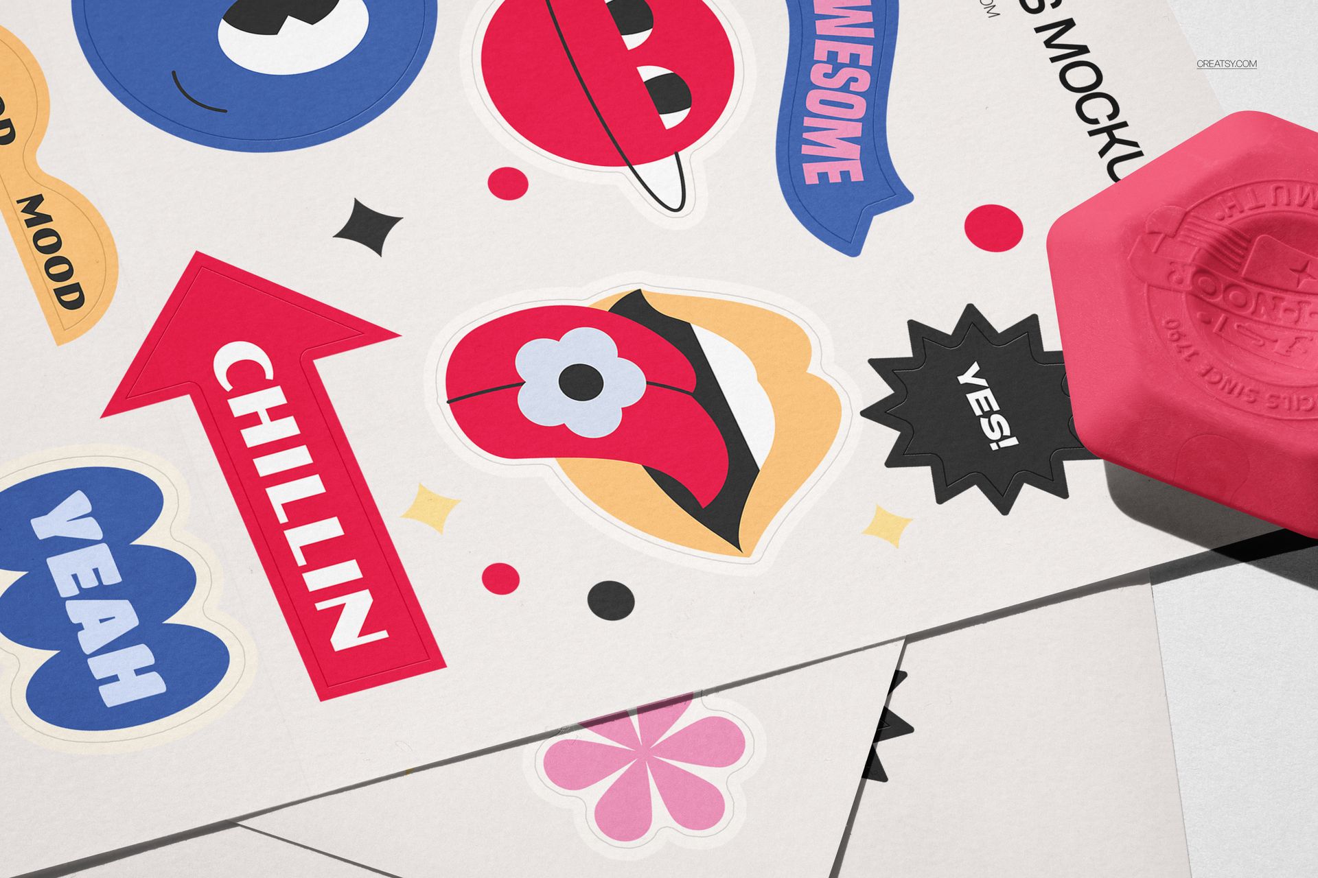 PSD mockup of vibrant stickers with cartoonish elements and speech bubbles placed on a neutral desk setting.