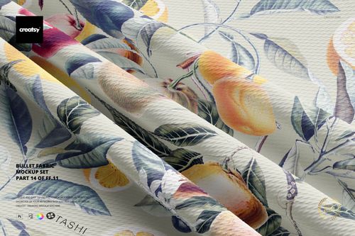 Front view of bullet fabric mockup with a botanical fruit pattern in yellow, orange, and green tones, draped in folds.