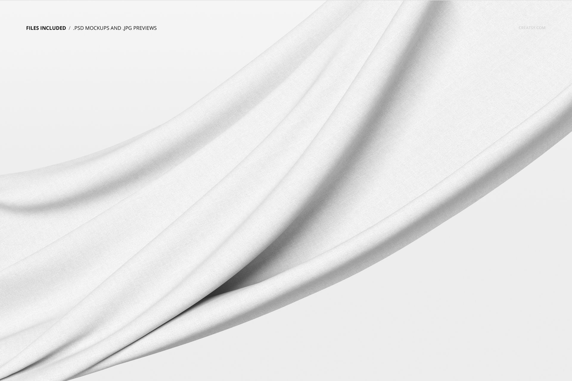 White textile mockup with gentle creases, suspended and flowing diagonally over a plain, light-colored backdrop.