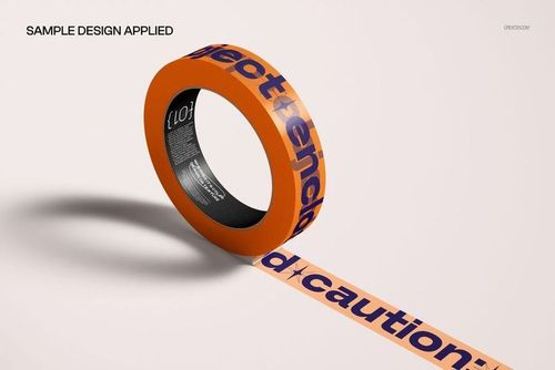 PSD mockup of a narrow duct tape roll with orange and purple caution text, displayed in a realistic setting.