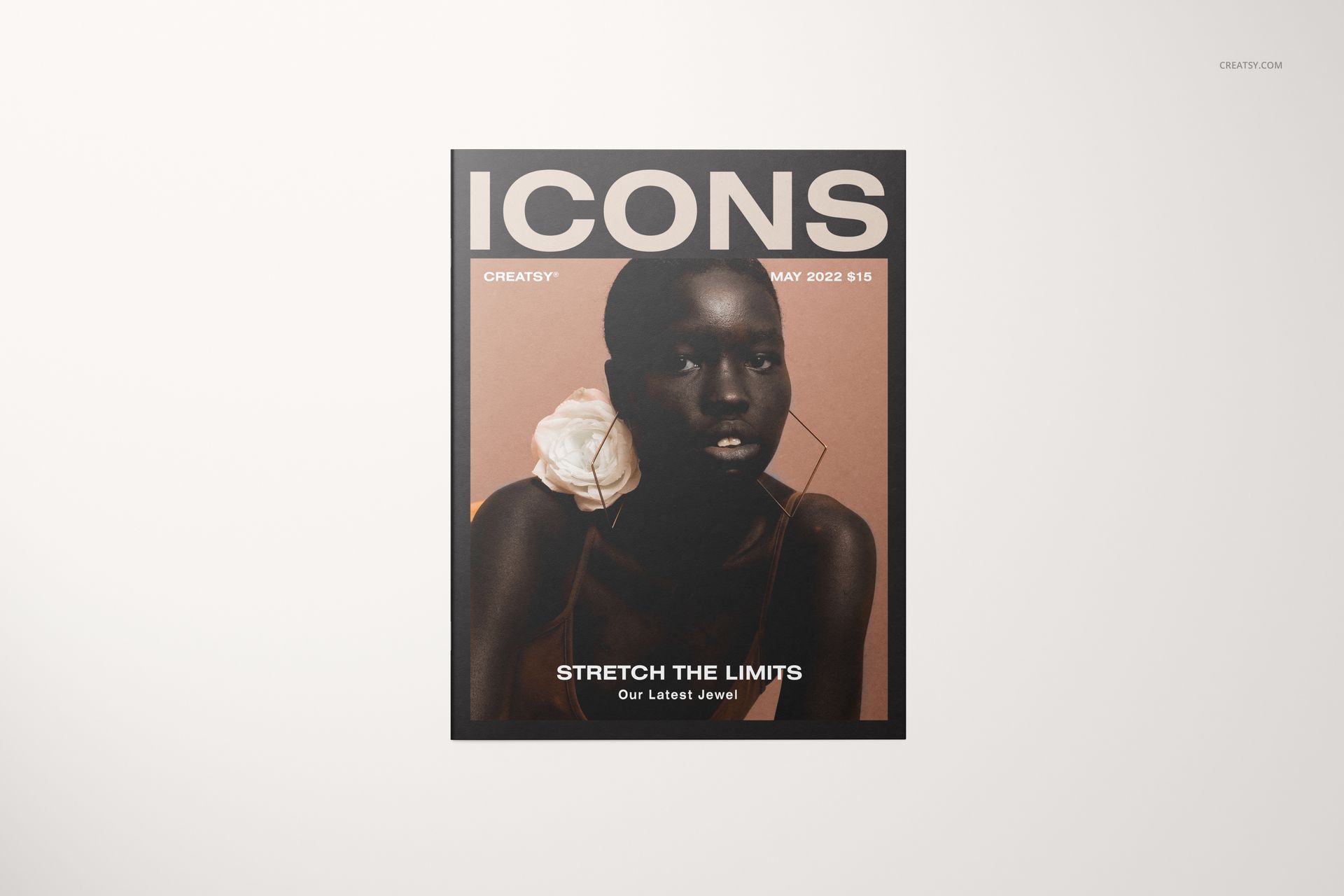 Front view of an 8.5x11 magazine mockup with a beige background, bold ICONS title, and minimalistic layout.