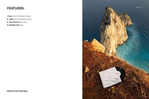 PSD mockup showing a black vinyl record and sleeve on the ground near a steep cliff with sea and rocks below.