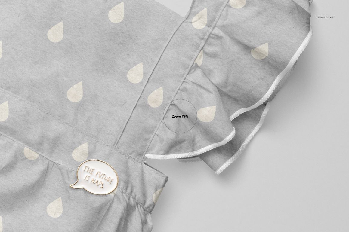 Close-up front view of a baby romper mockup with light gray fabric, white raindrop pattern, and ruffled sleeves.