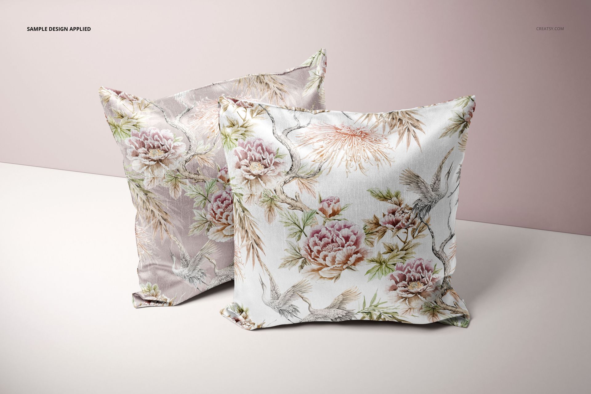 Front view of two decorative cushion covers featuring pastel floral designs, shown in a realistic PSD mockup scene.