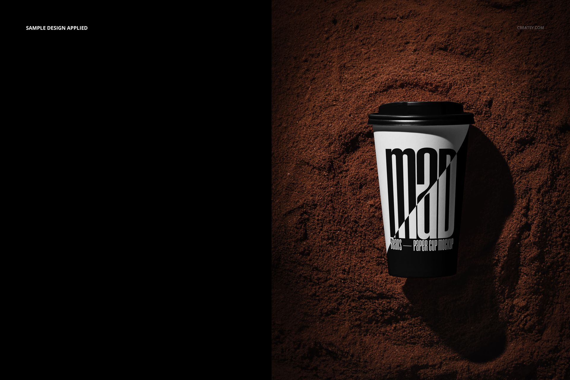Paper cup mockup featuring a black lid and modern typography, positioned on a rich brown coffee ground surface.