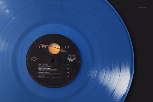 Top view of a translucent blue vinyl record mockup featuring a planet illustration on the center label.