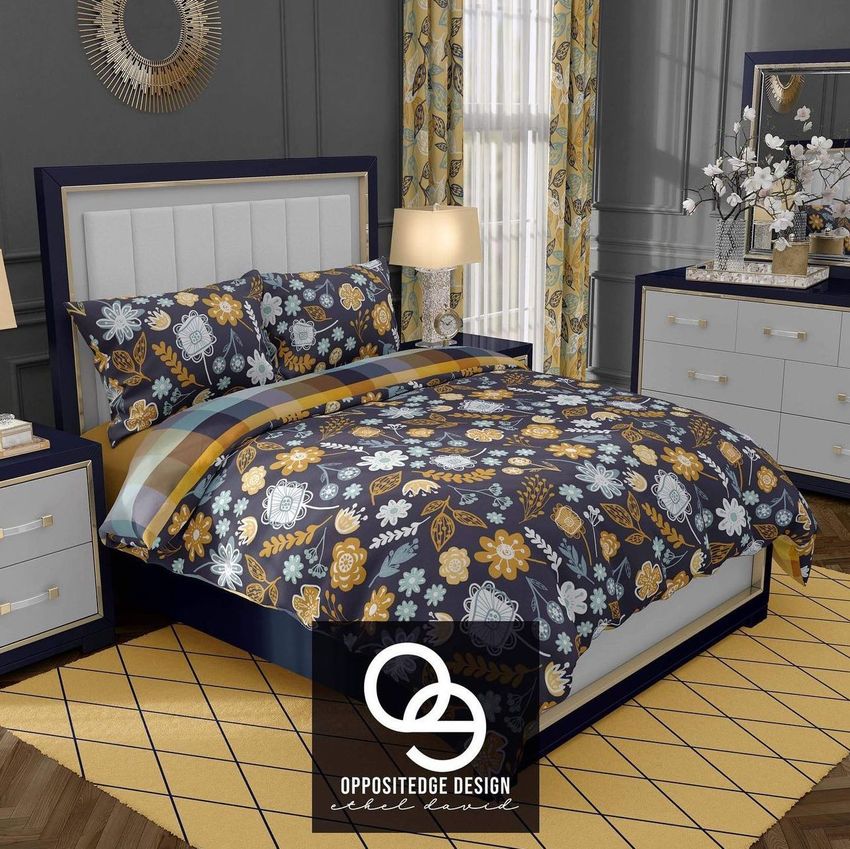 Luxury bedroom bedding mockup featuring a bed with dark floral-patterned duvet and pillows, surrounded by gray walls and yellow accents.