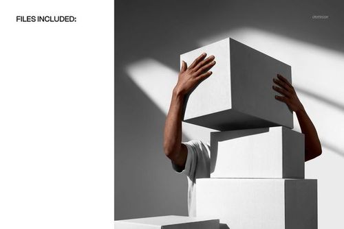 Person holding a stack of plain white packaging boxes, with arms partially visible, in a front view mockup scene.