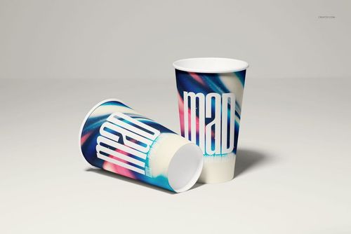 Paper cup PSD mockup featuring vibrant swirling colors and large white lettering, shown upright and lying down.