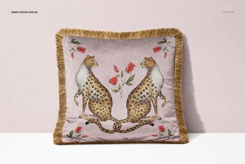 Front view of a fringed velvet cushion with a mockup design featuring two leopards and red roses on a light background.