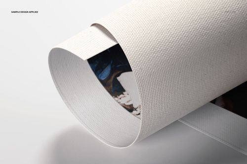 Close-up of a rolled canvas print mockup displaying textured material and a glimpse of printed design within the roll.