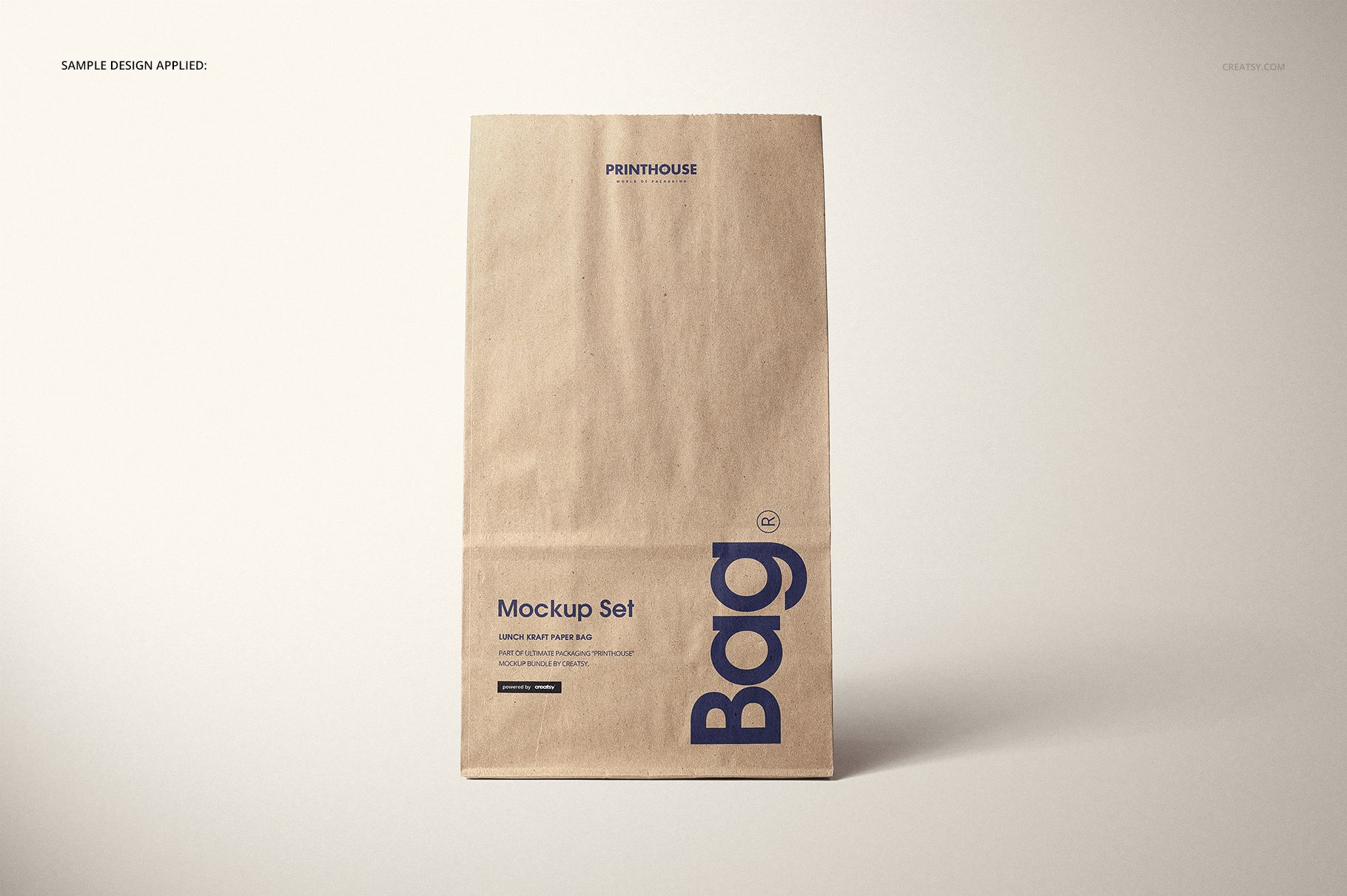 Kraft paper lunch bag mockup displayed vertically, featuring minimal blue text design on a plain surface.