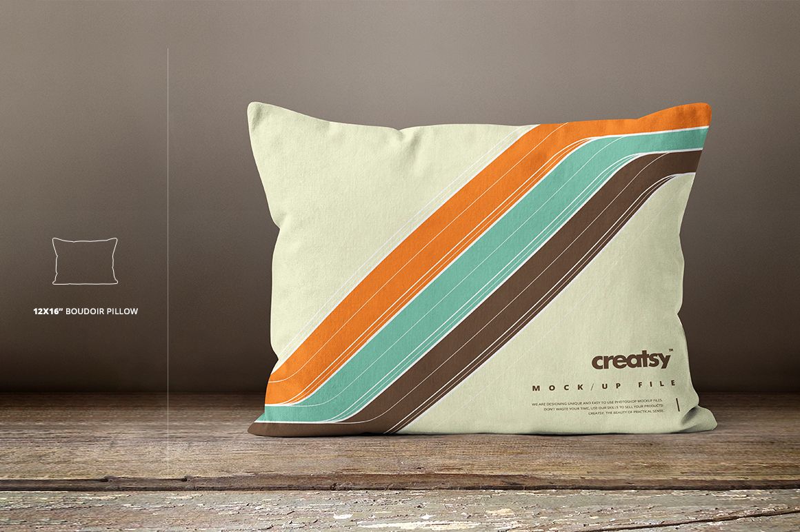 Boudoir pillow mockup featuring colorful diagonal stripes, displayed against a neutral wall and rustic wood floor.