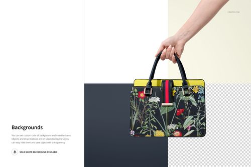 Leather handbag mockup with black handles and vibrant botanical print, displayed in hand with split white and transparent background.