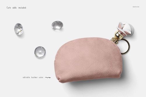 Light pink coin purse mockup featuring a gold ring and charm, placed next to crystal-like props on a plain backdrop.
