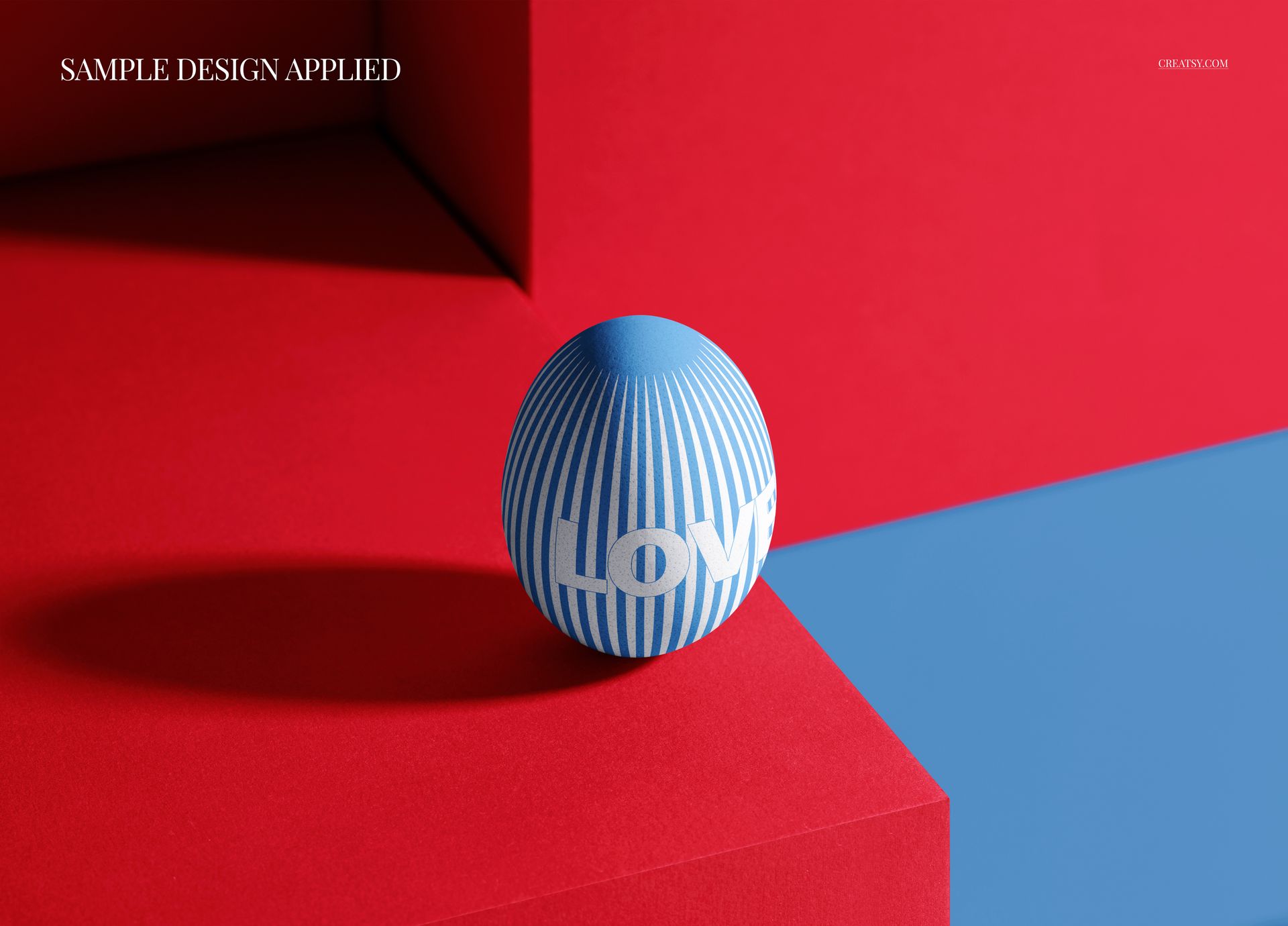 Blue Easter egg with white geometric stripes and 'LOVE' text, placed on a red pedestal in a modern mockup scene.