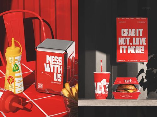 Fast food restaurant branding mockup featuring burger boxes, drink cups, and condiments in a red-themed setting.