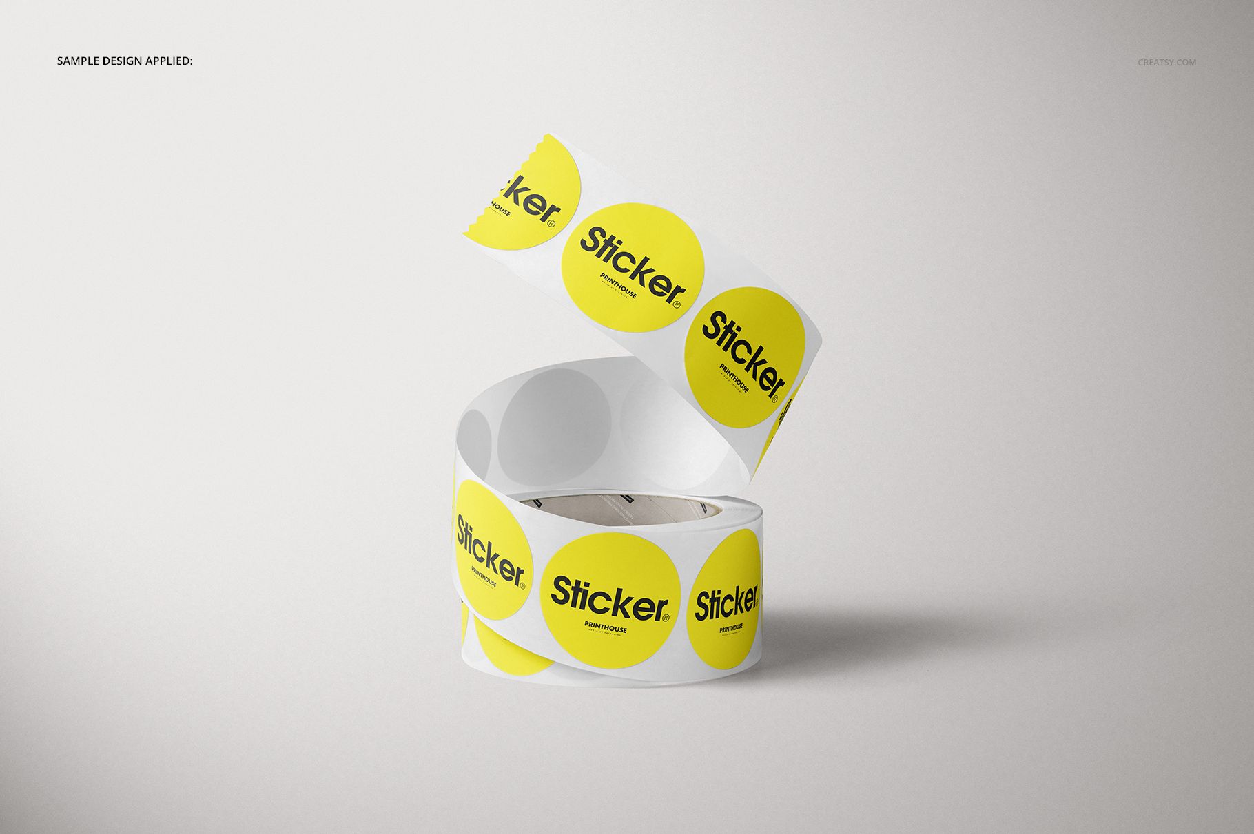 PSD mockup featuring a roll of circular stickers in yellow with black text, presented from a front angle.