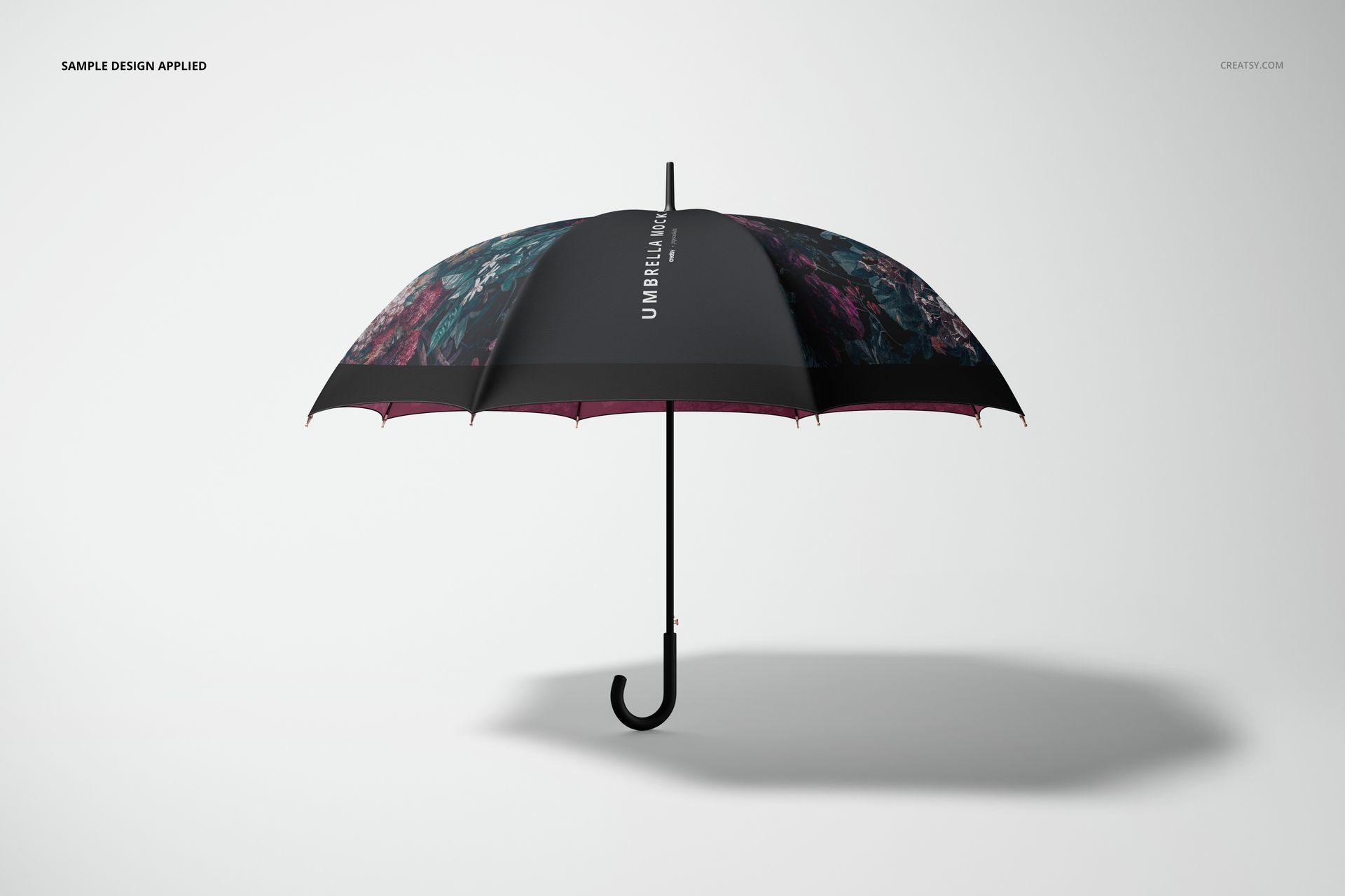 Open umbrella mockup with a black canopy featuring abstract colorful patterns, shown in a side view on a plain background.