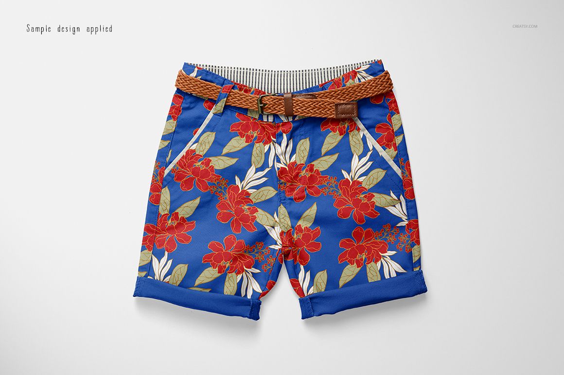 Kids shorts mockup with a brown woven belt, featuring a bold red floral pattern on a blue background, top view.