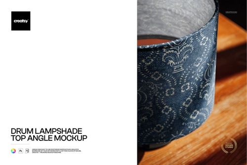 Blue patterned drum lampshade mockup shown from above on a wooden table, highlighting intricate decorative details.