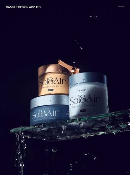 PSD mockup of skincare jars with gold and silver lids on a wet glass shelf, surrounded by water droplets and splashes.