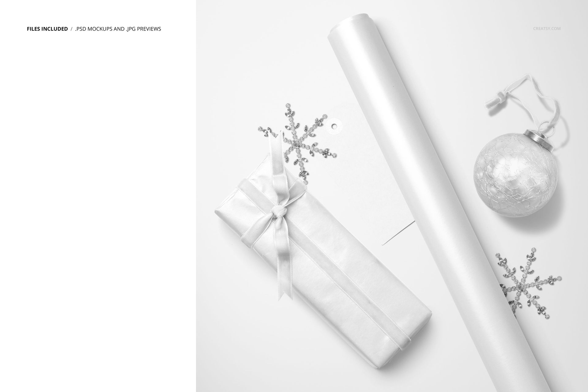 Christmas PSD mockup featuring a rectangular present, ribbon, wrapping paper, and festive decorations on a white surface.