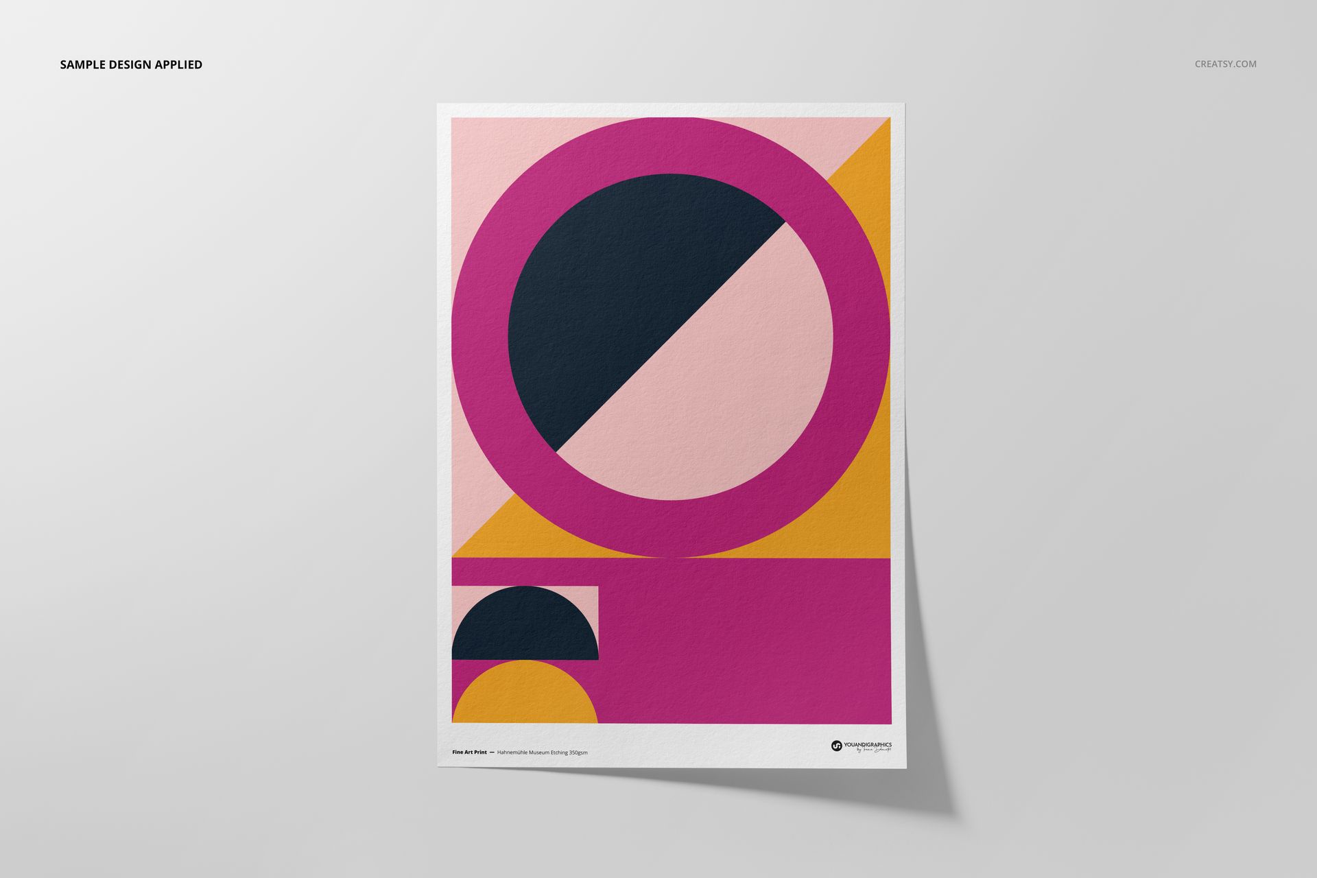 A3 fine art print mockup featuring a geometric abstract design in pink, yellow, black, and white on a flat surface.