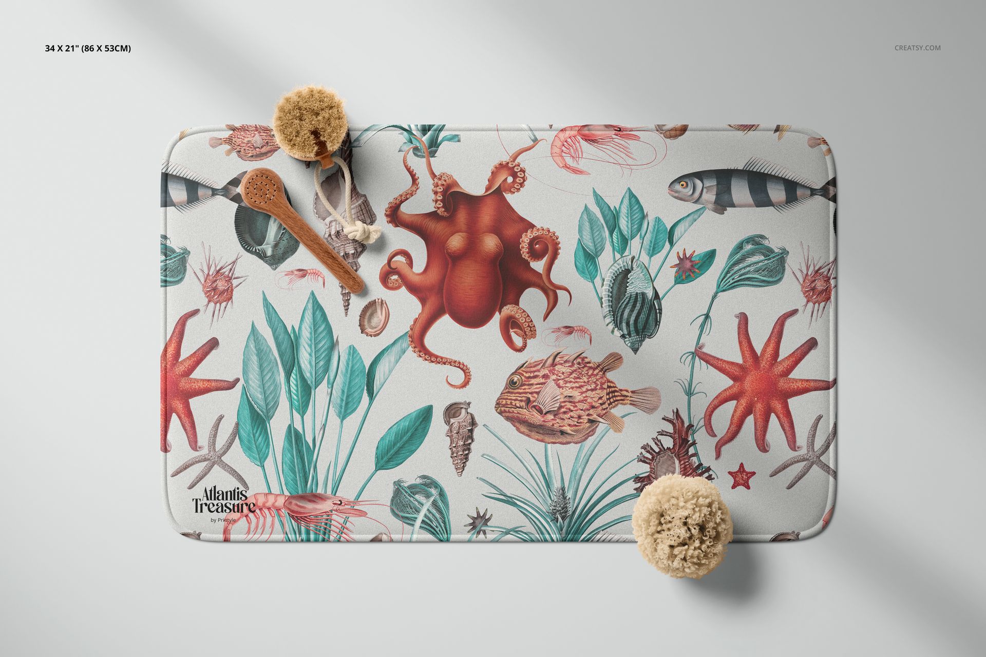 Top view of a microfiber bath rug mockup featuring colorful ocean animals and foliage, styled with sponges and a brush.