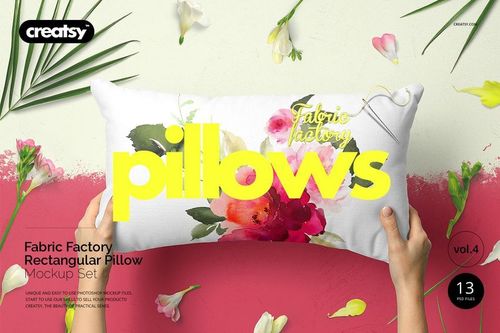 Front view of a rectangular pillow mockup featuring watercolor-style flowers, held by hands with flowers nearby.