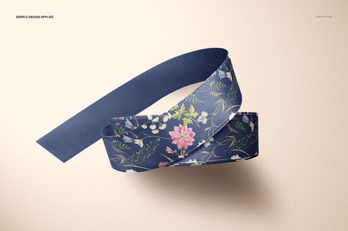 Ribbon mockup featuring a blue fabric ribbon with a floral pattern, displayed on a neutral beige background.