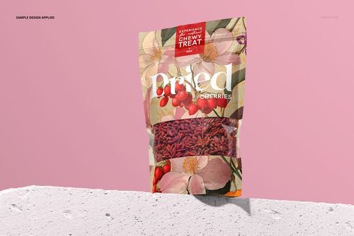 Front view of a paper pouch mockup for dried goji berries, featuring floral artwork and clear product window against a pink background.