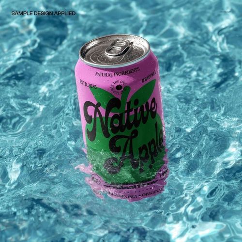 Pink and green soda can partially submerged in clear sunlit water, front view, drinkware PSD mockup scene.