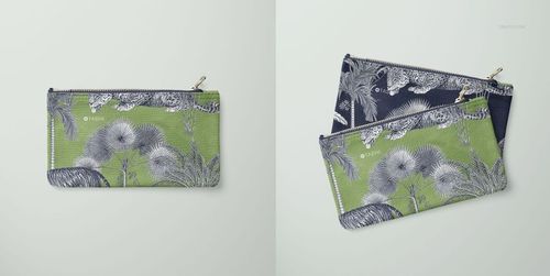 Flat canvas pouch with a zipper, featuring a botanical and animal print design in green and navy, shown from above.