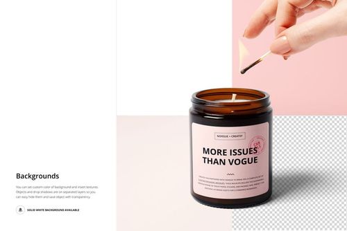 Amber jar candle mockup with a light pink label, shown from the front as a hand lights the wick with a match.