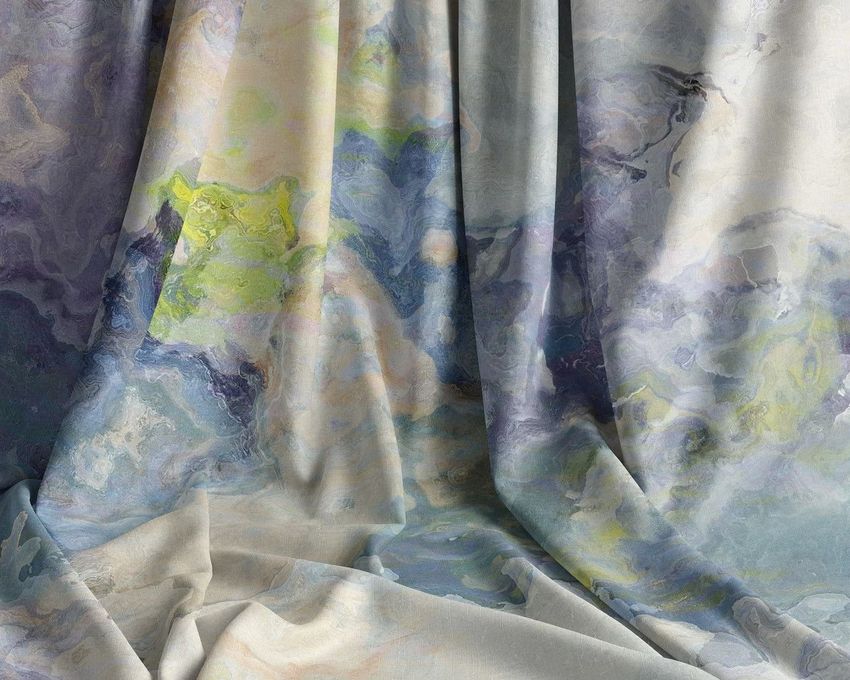 Draped fabric mockup featuring an abstract watercolor pattern in soft blues, greens, and yellows with gentle folds.