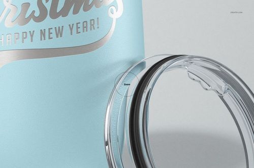Close-up of a light blue stemless wine cup with metallic text and a transparent plastic lid beside it.