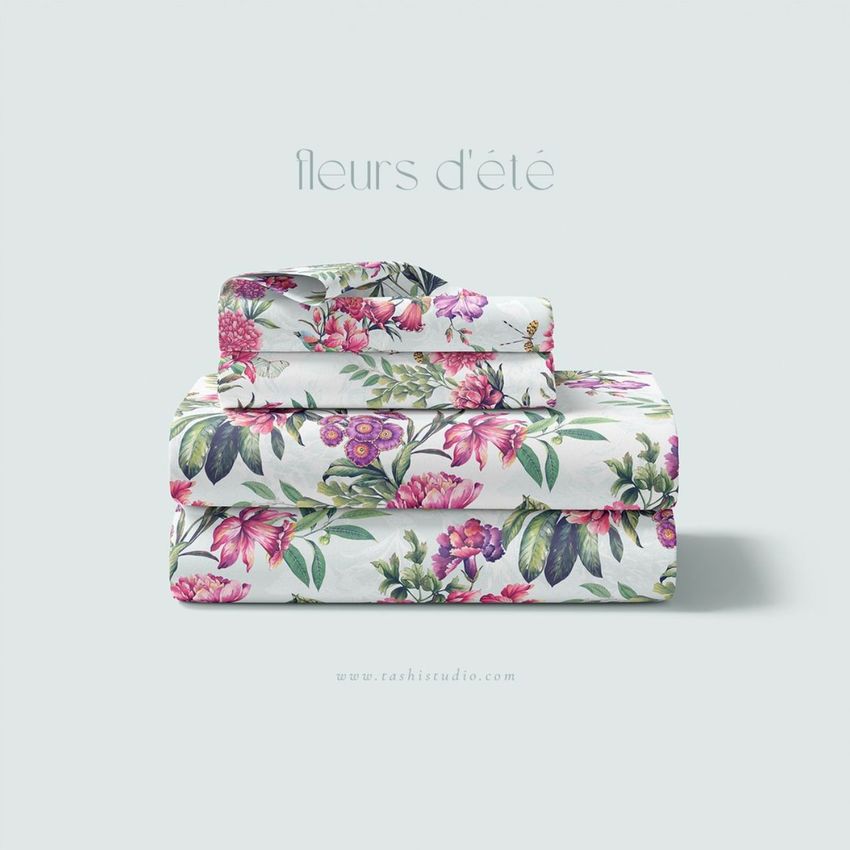 Folded bedding set mockup featuring stacked sheets and pillowcases with a colorful floral pattern on a light background.