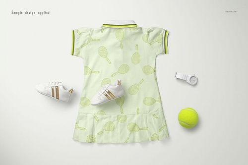 Kids polo dress mockup displayed from the back, featuring a light green color with tennis racket pattern, shown with shoes and tennis ball.