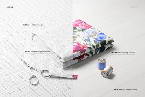 Folded fabric mockup featuring a floral patterned textile, metal scissors, and two spools of thread on a light surface.