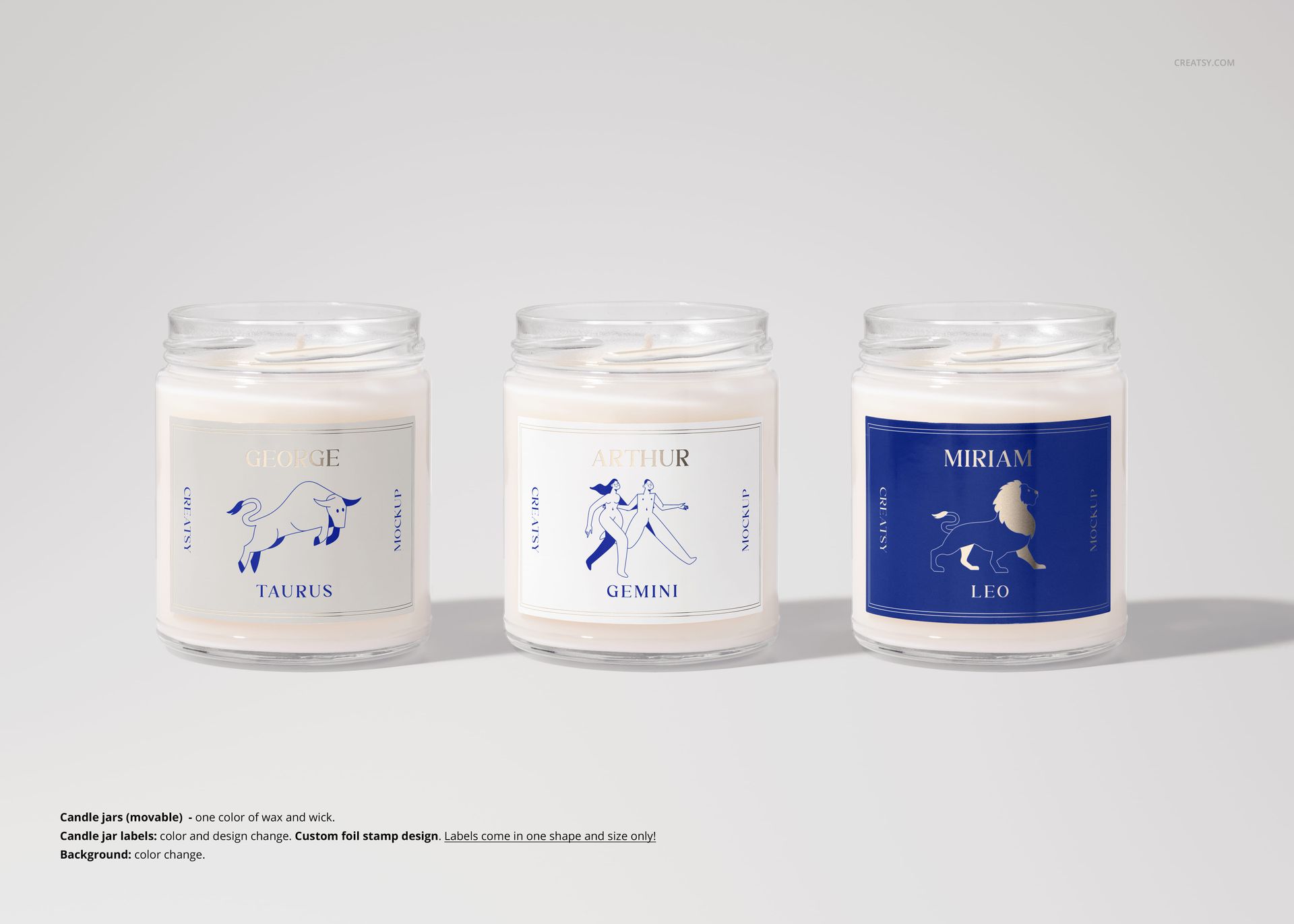 Three 9oz scented candle jars with zodiac-themed blue and white labels, arranged side by side on a light surface.