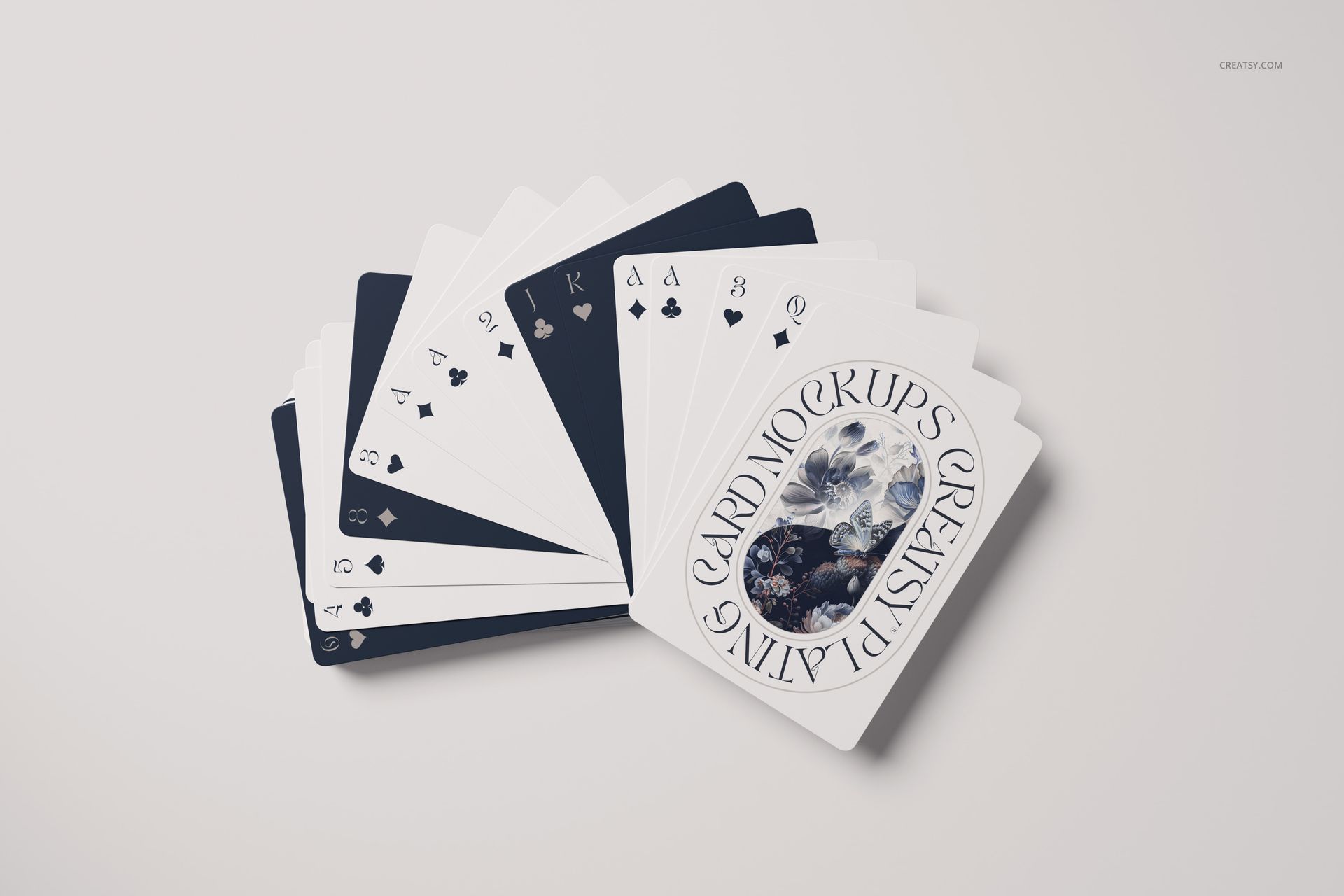 Fanned playing cards mockup set displayed on a light surface, showing both face cards and custom card backs.