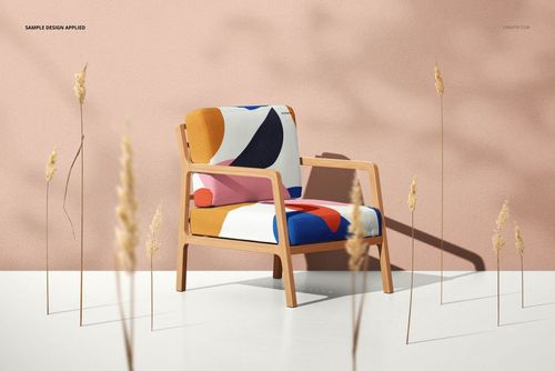 Lounge chair with wooden frame and colorful abstract patterned upholstery, front view against a pink wall, mockup scene.