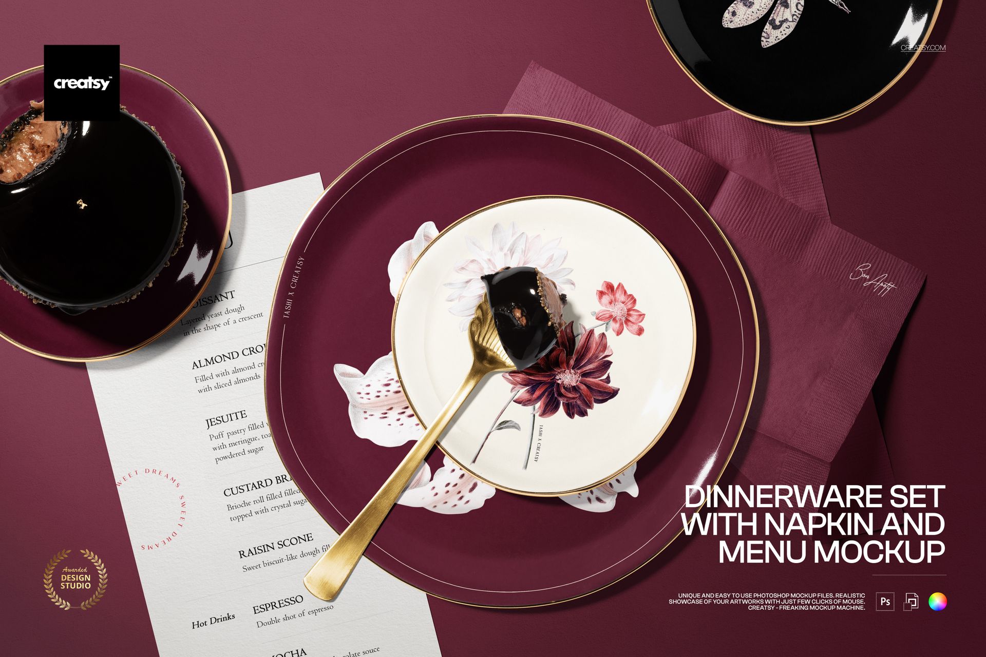 Elegant dinnerware set mockup featuring floral plates, gold fork, menu card, and napkin arranged on burgundy surface.