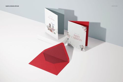 Set of 5x7 greeting cards mockup featuring festive illustrations, shown with a red envelope on a white surface.