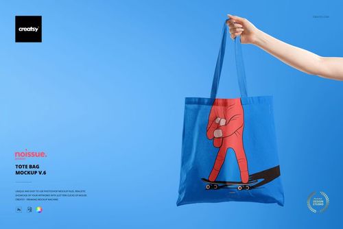 Blue tote bag mockup featuring a playful illustration of a hand riding a skateboard, displayed on a blue backdrop.