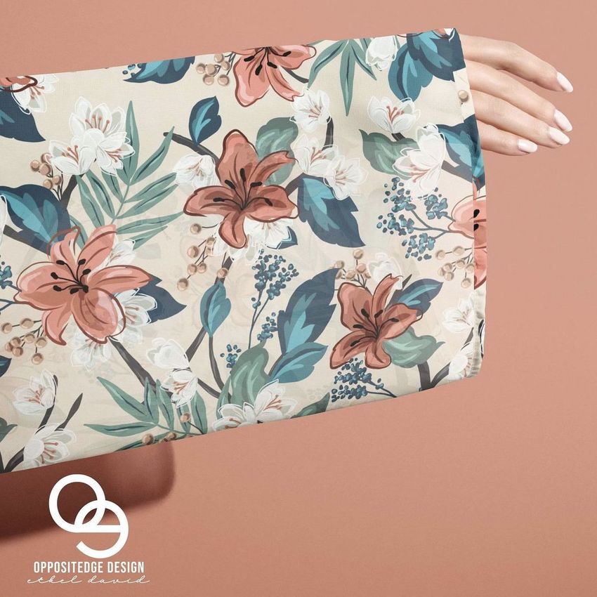 Chiffon kimono mockup featuring a beige fabric with a floral pattern in muted pink, green, and white, shown on an arm against a peach background.
