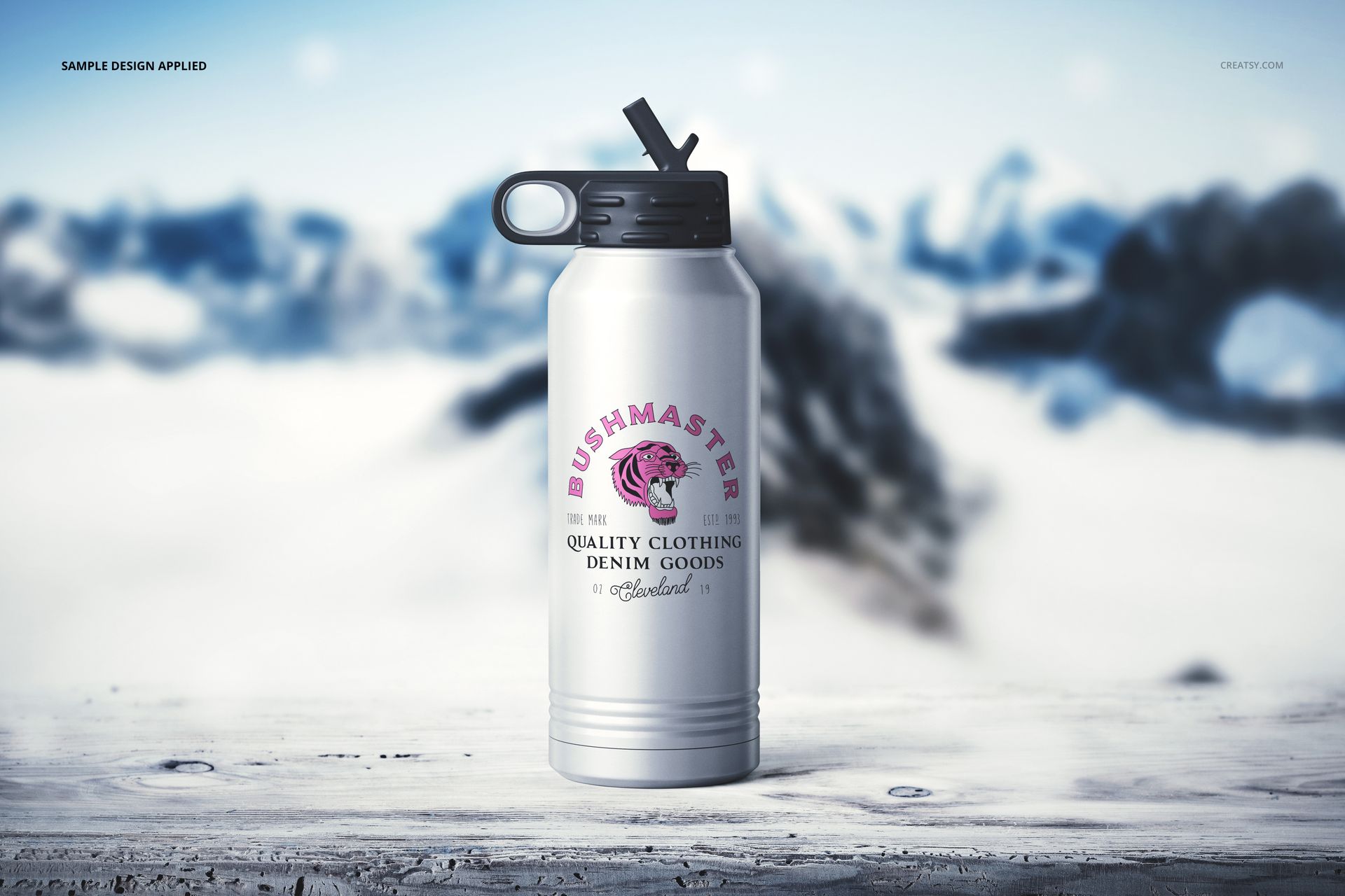 Front view of a 32 oz. stainless steel water bottle mockup featuring a custom design, set outdoors in a winter scene.