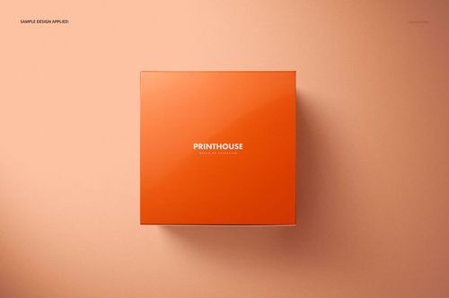 Square chipboard gloss gift box in orange color, viewed from above on a peach background, mockup scene.