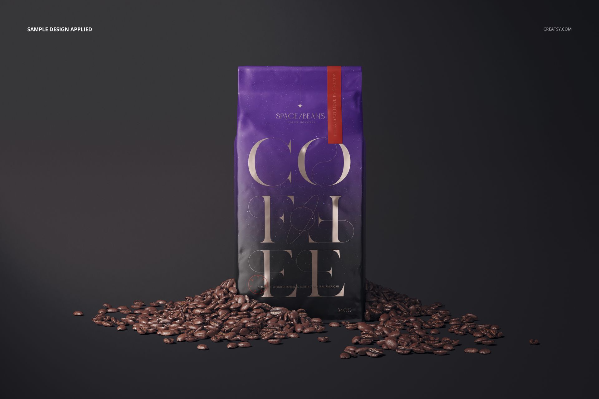 Glossy coffee bag mockup standing upright on a dark surface, surrounded by scattered coffee beans, front view.